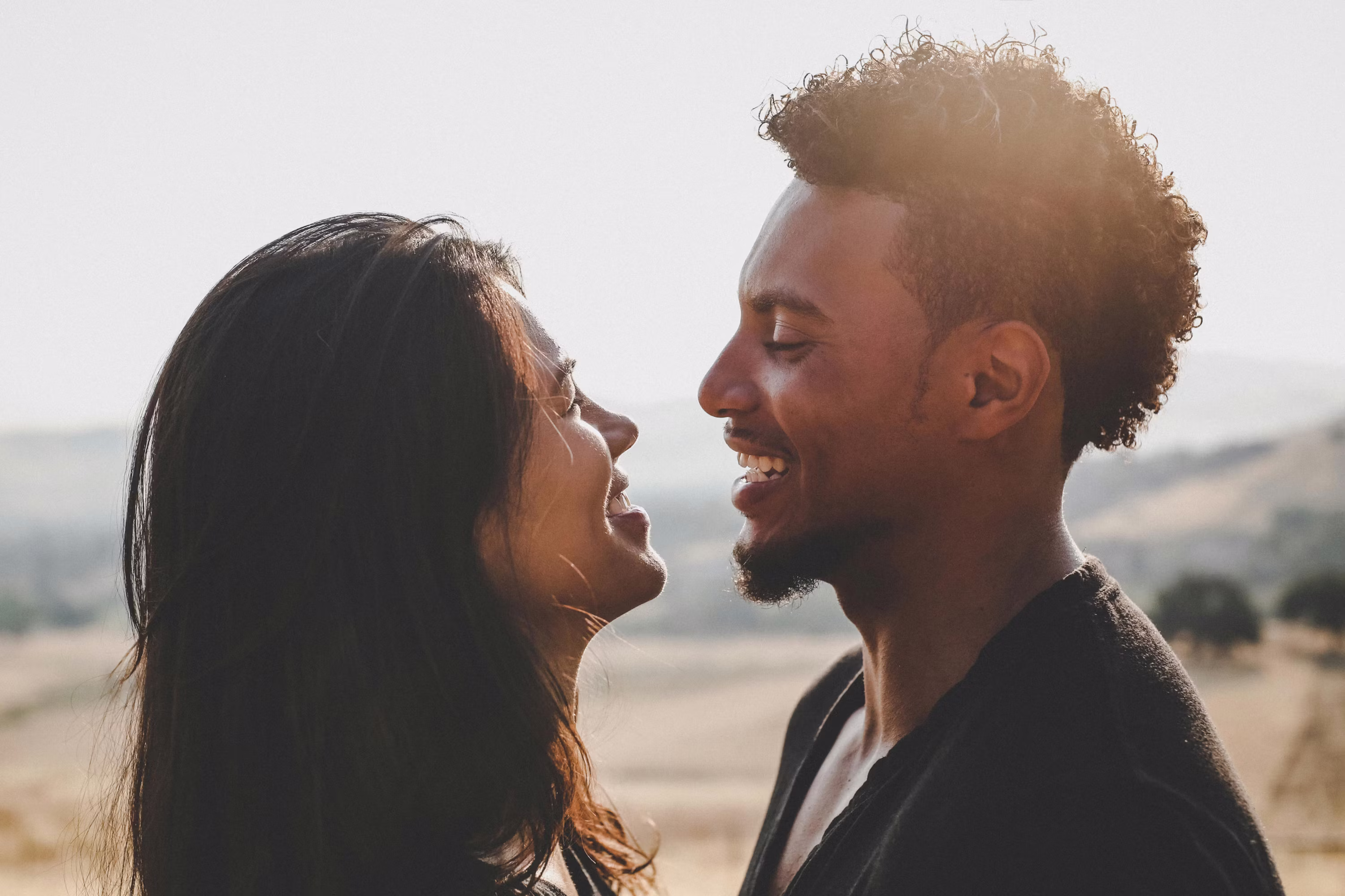 Couple embracing at golden hour